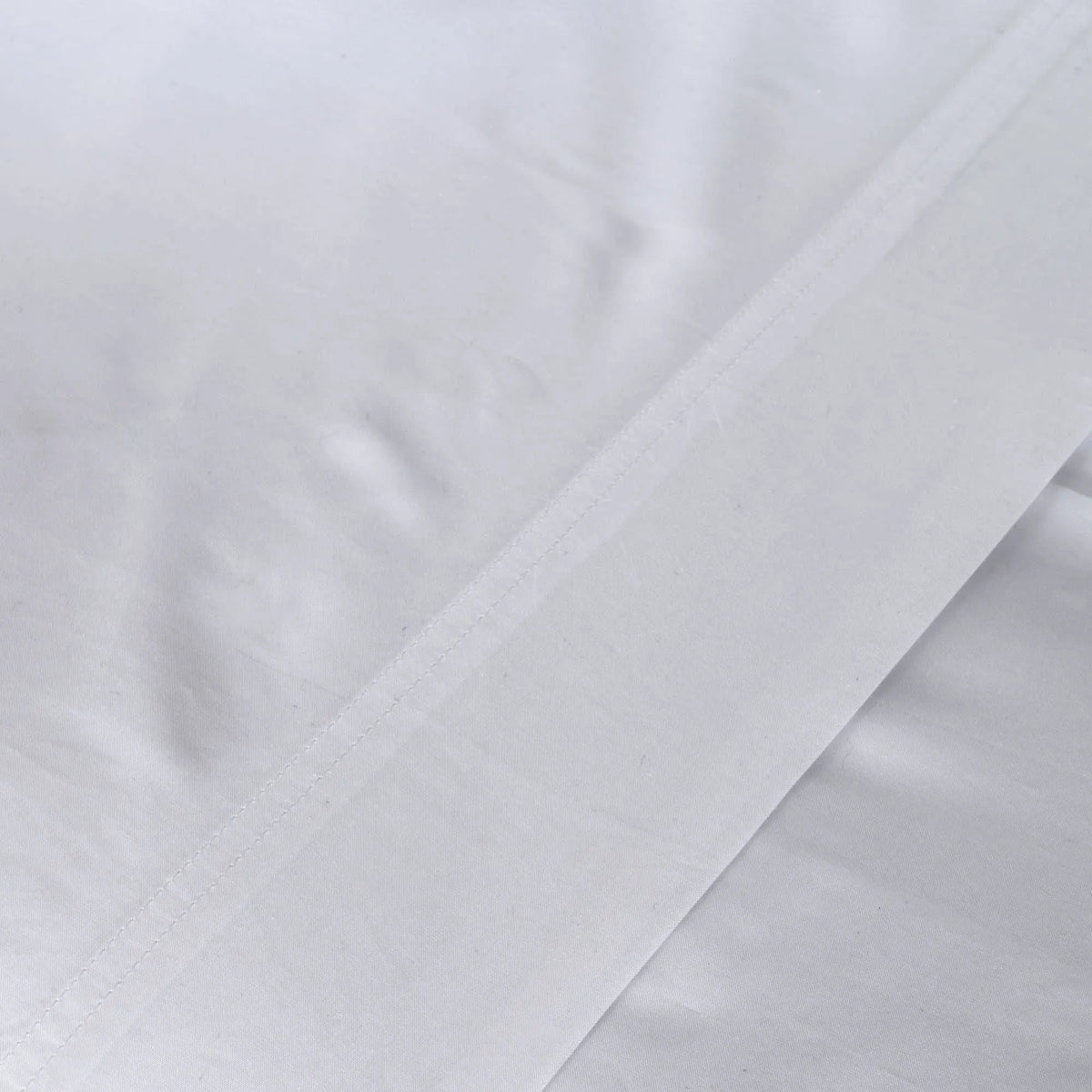 St Genève Sintra 300 thread count percale bedding in crisp white. Available in duvet covers, flat/fitted sheets, shams and pillowcases
