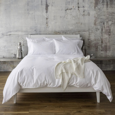 St Genève Sintra 300 thread count percale bedding in crisp white. Available in duvet covers, flat/fitted sheets, shams and pillowcases