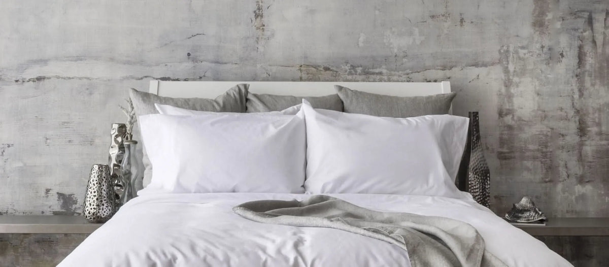 St Genève Sintra 300 thread count percale bedding in crisp white. Available in duvet covers, flat/fitted sheets, shams and pillowcases