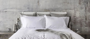 St Genève Sintra 300 thread count percale bedding in crisp white. Available in duvet covers, flat/fitted sheets, shams and pillowcases