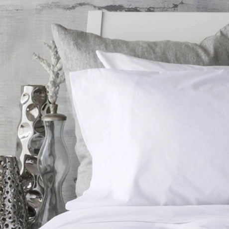 St Genève Sintra 300 thread count percale bedding in crisp white. Available in duvet covers, flat/fitted sheets, shams and pillowcases
