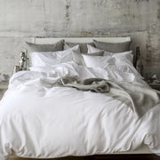 St Genève Sintra 300 thread count percale bedding in crisp white. Available in duvet covers, flat/fitted sheets, shams and pillowcases