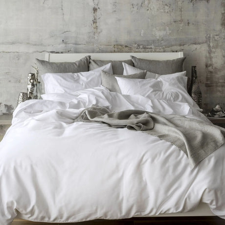 St Genève Sintra 300 thread count percale bedding in crisp white. Available in duvet covers, flat/fitted sheets, shams and pillowcases