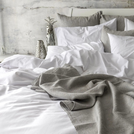 St Genève Sintra 300 thread count percale bedding in crisp white. Available in duvet covers, flat/fitted sheets, shams and pillowcases