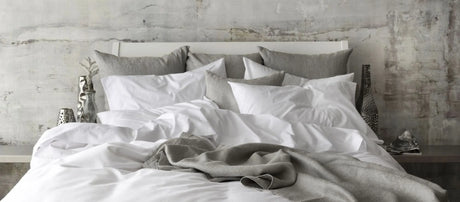 St Genève Sintra 300 thread count percale bedding in crisp white. Available in duvet covers, flat/fitted sheets, shams and pillowcases