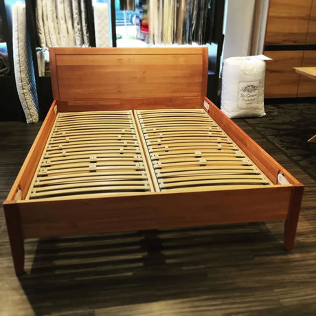 TEAM 7 sesam bed in cherry w/ Berkeley Ergonomics Suspension Slats. Photograhed in our Calgary showroom