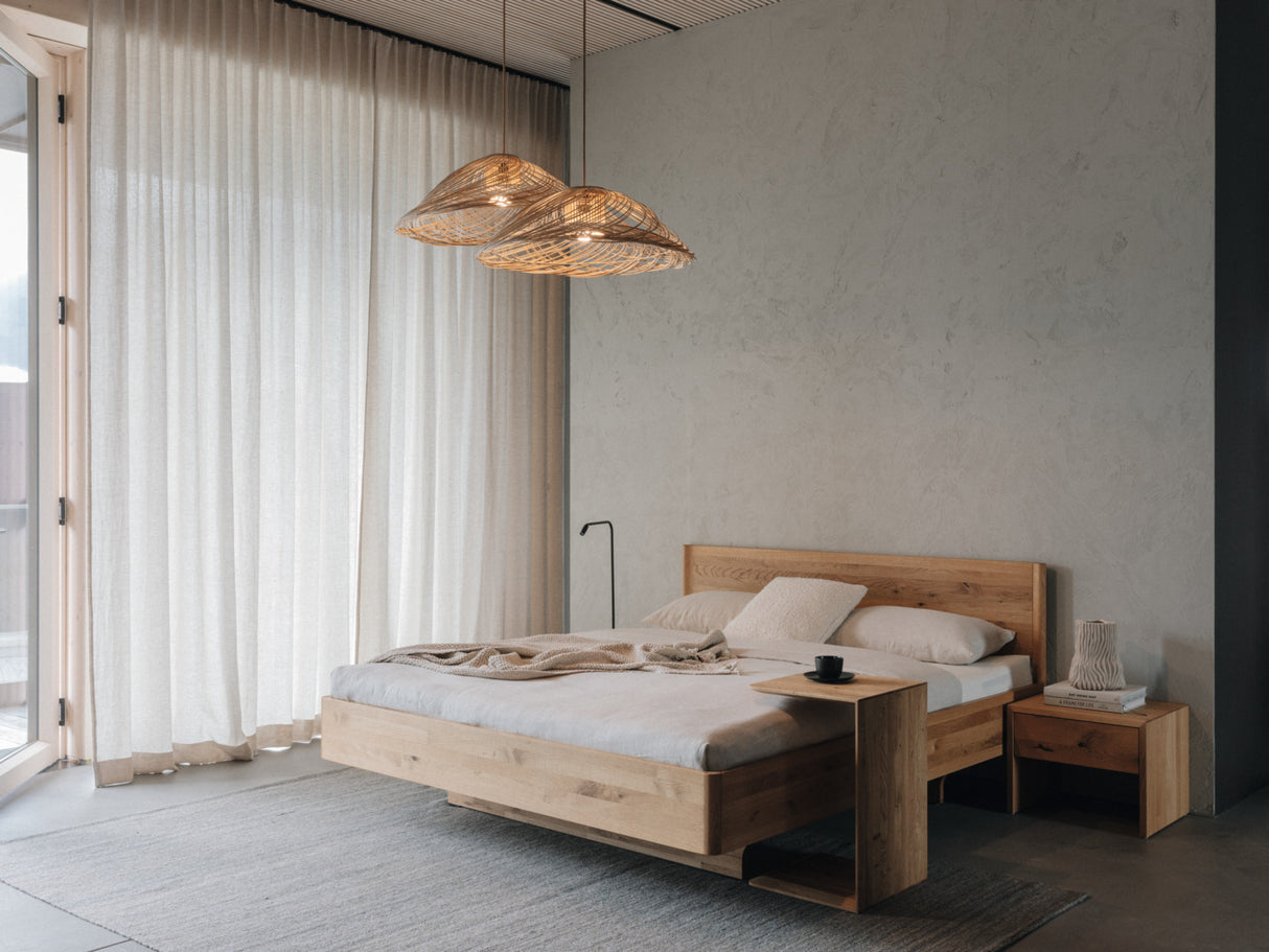 TEAM 7 times bed in wild natural oil oak, w/ clip table and lunetto nightstand. photo: TEAM 7