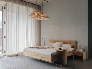TEAM 7 times bed in wild natural oil oak, w/ clip table and lunetto nightstand. photo: TEAM 7