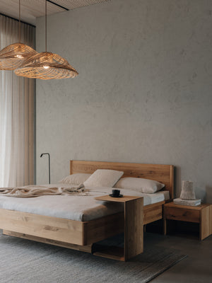 TEAM 7 times bed in wild natural oil oak, w/ clip table and lunetto nightstand. photo: TEAM 7