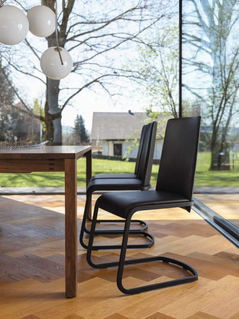 F1 Chair, shown in Black leather w/ Matte Black steel frame