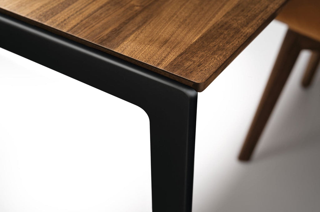 TEAM 7 tak table in walnut w/ matte black frame. photo: TEAM 7 - Available in Canada form The Mattress & Sleep Co.