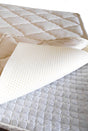 A closeup of the natural latex + micro pocket spring mattress topper. Wonderfully adaptive and supportive.